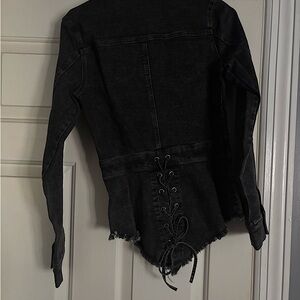 Brand new! Never been worn Very cute Black zip up denim top.